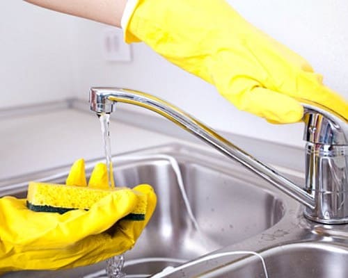 Kitchen Sink Washing With Sponge And Germs.